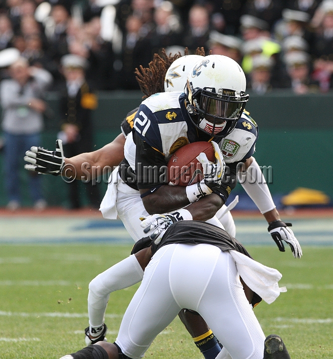 122912 Kraft SA-044.JPG - Dec 29, 2012; San Francisco, CA, USA; Navy Midshipmen Gee Gee Greene (21) is tackled after returning a kickoff against the Arizona State Sun Devils in the 2012 Kraft Fighting Hunger Bowl at AT&T Park.